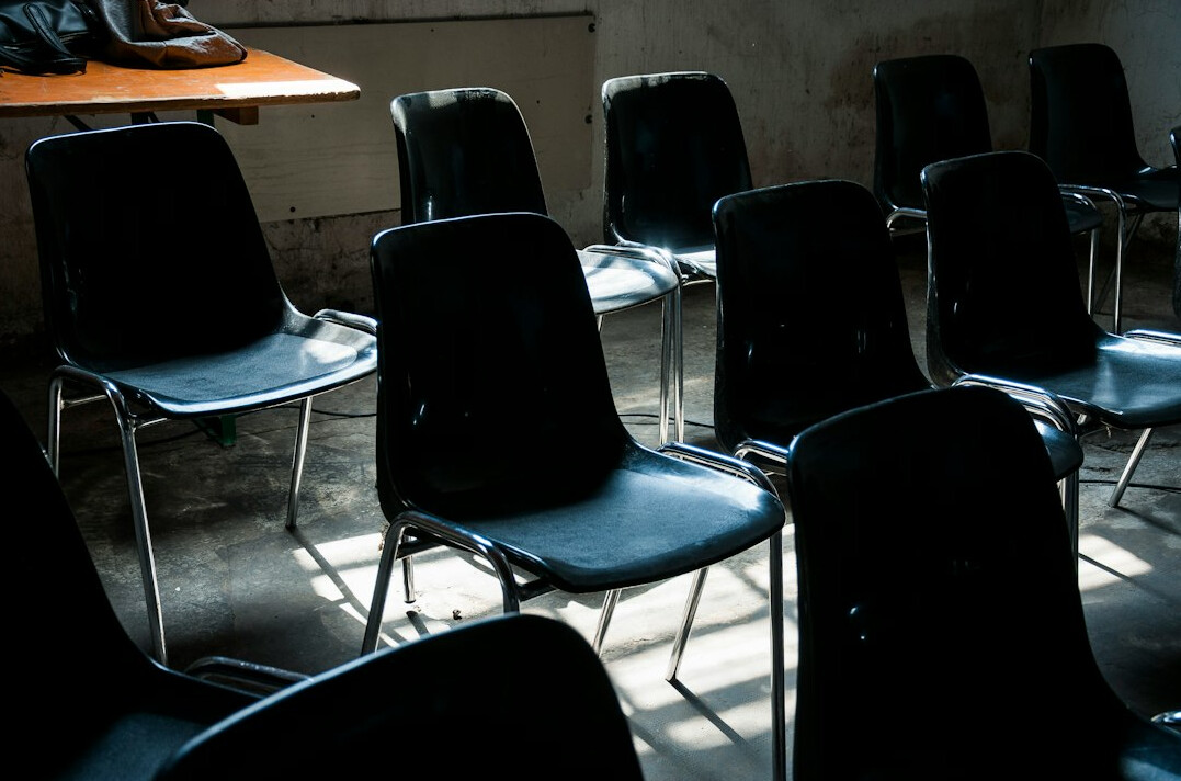 Group training session in a bright classroom with a presenter screen