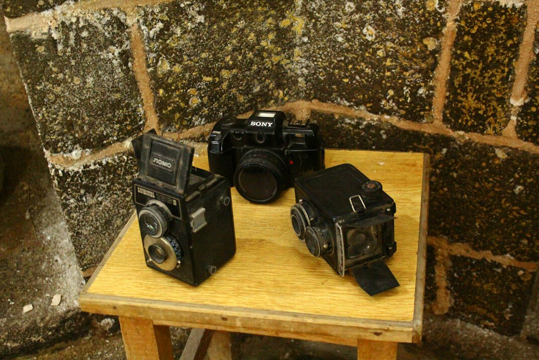 Broadcast cameras pointed at a television studio set