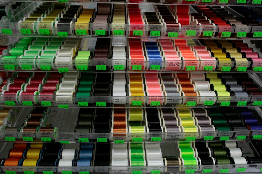 Shelves of archival video tapes and film reels in a media archive