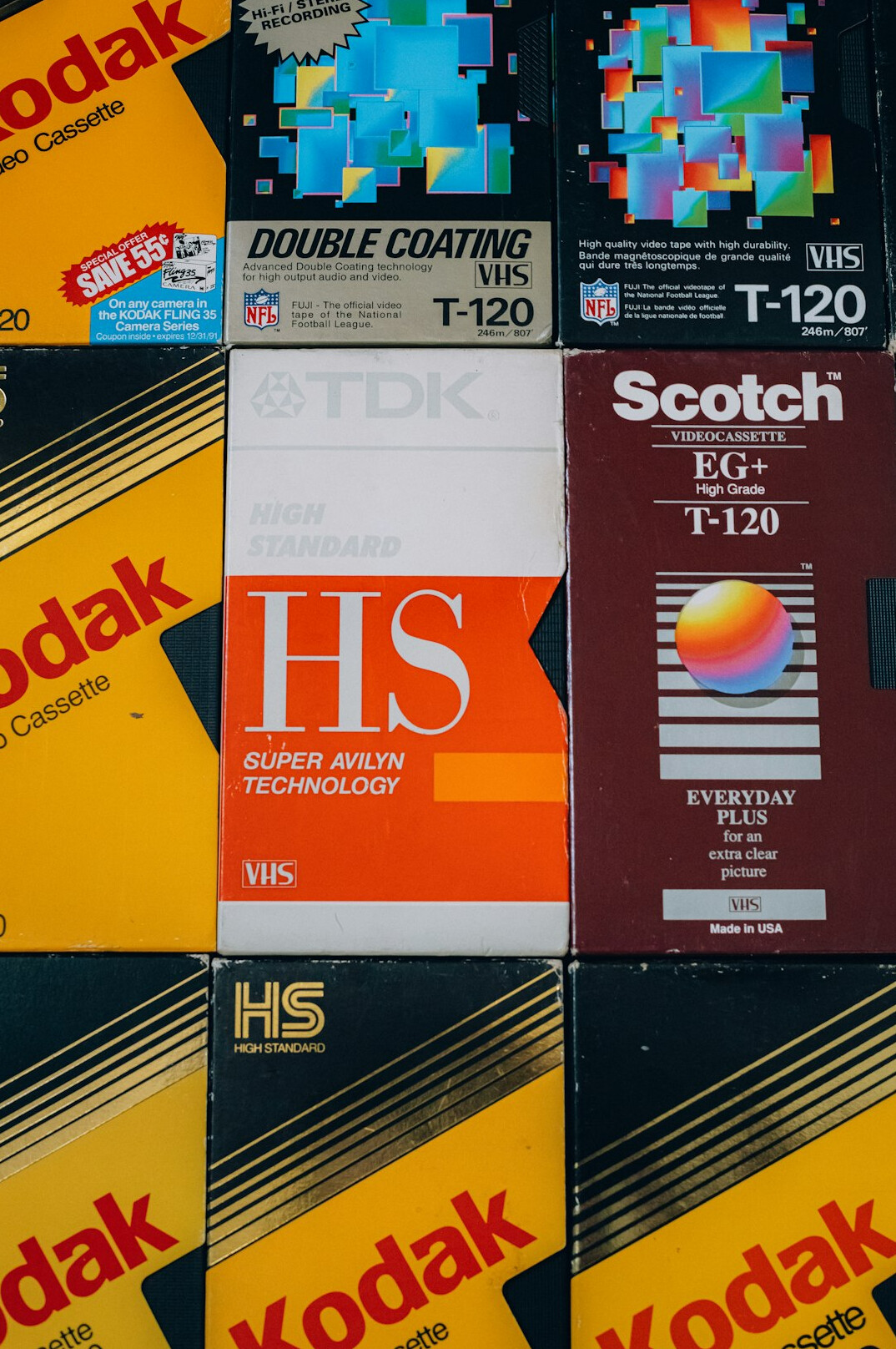 Stack of labelled VHS videotapes close up